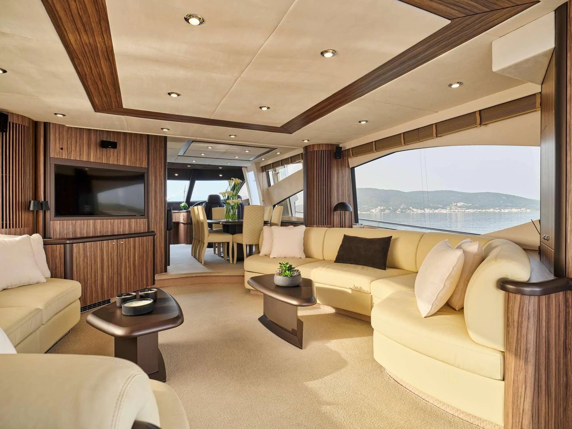 a living room with a large window aboard M FIVE Yacht for Charter