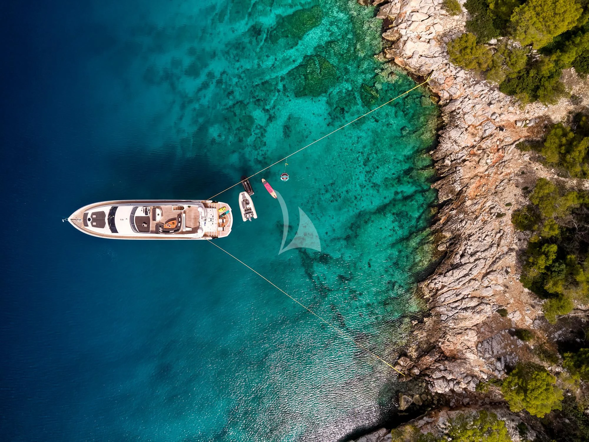 a sign on a cliff aboard M FIVE Yacht for Charter