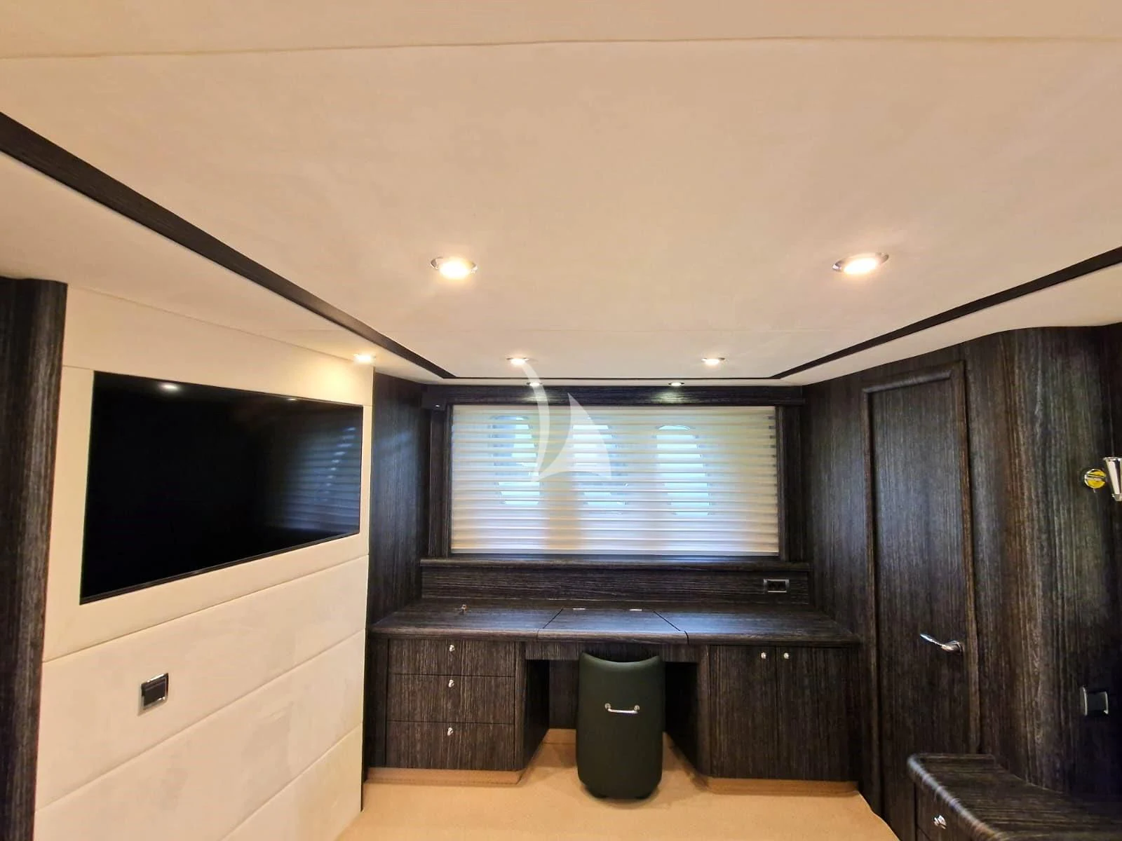 a tv on a stand in a room aboard M FIVE Yacht for Charter