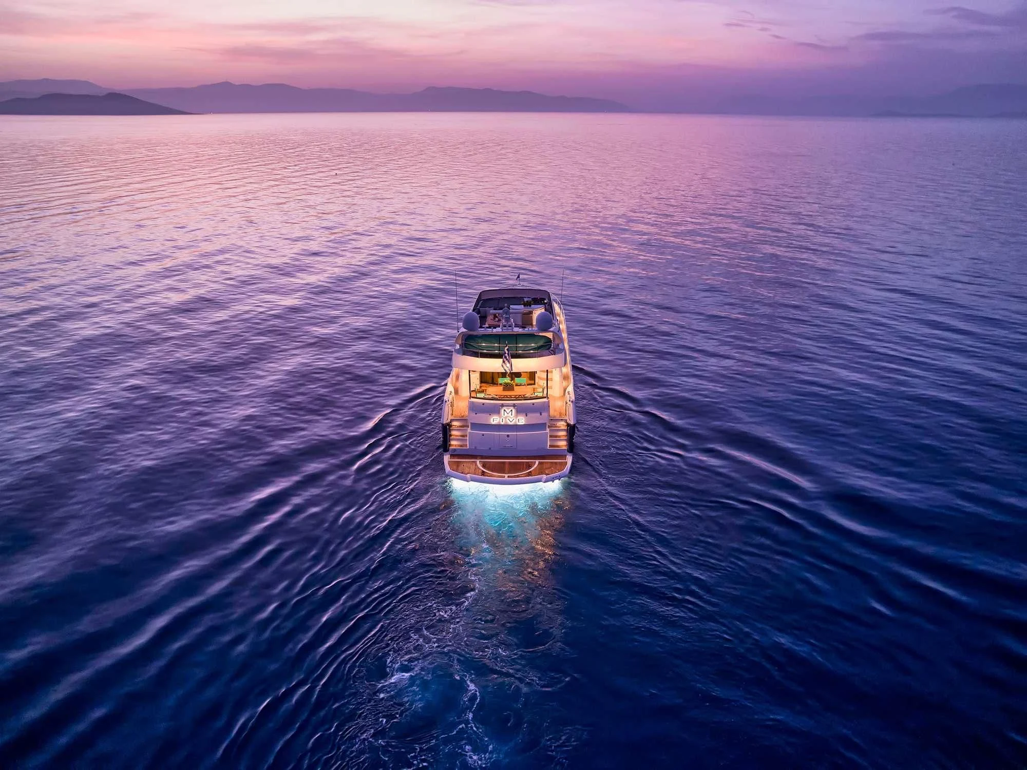 a boat on the water aboard M FIVE Yacht for Charter