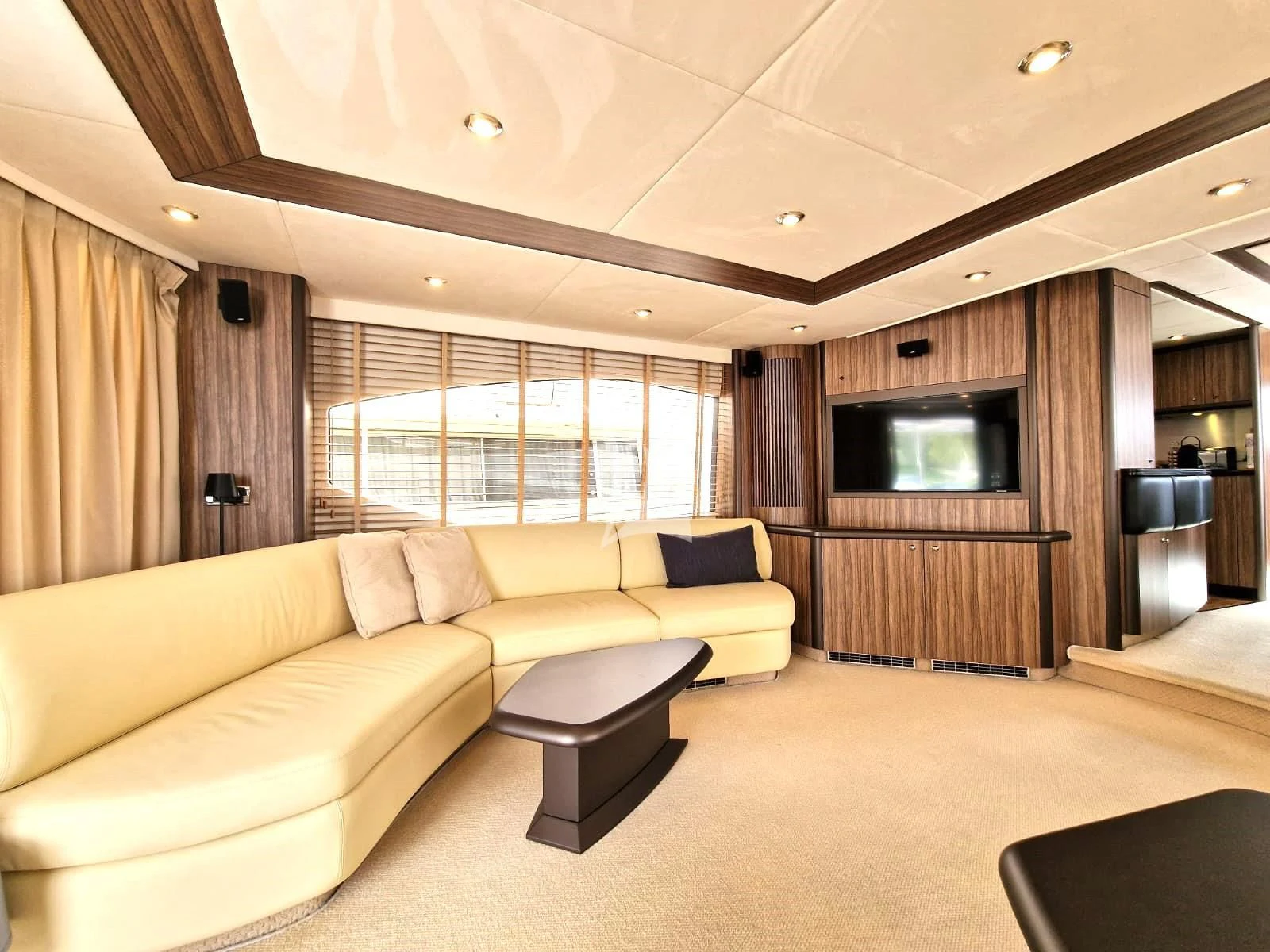 a living room with a couch and a tv aboard M FIVE Yacht for Charter