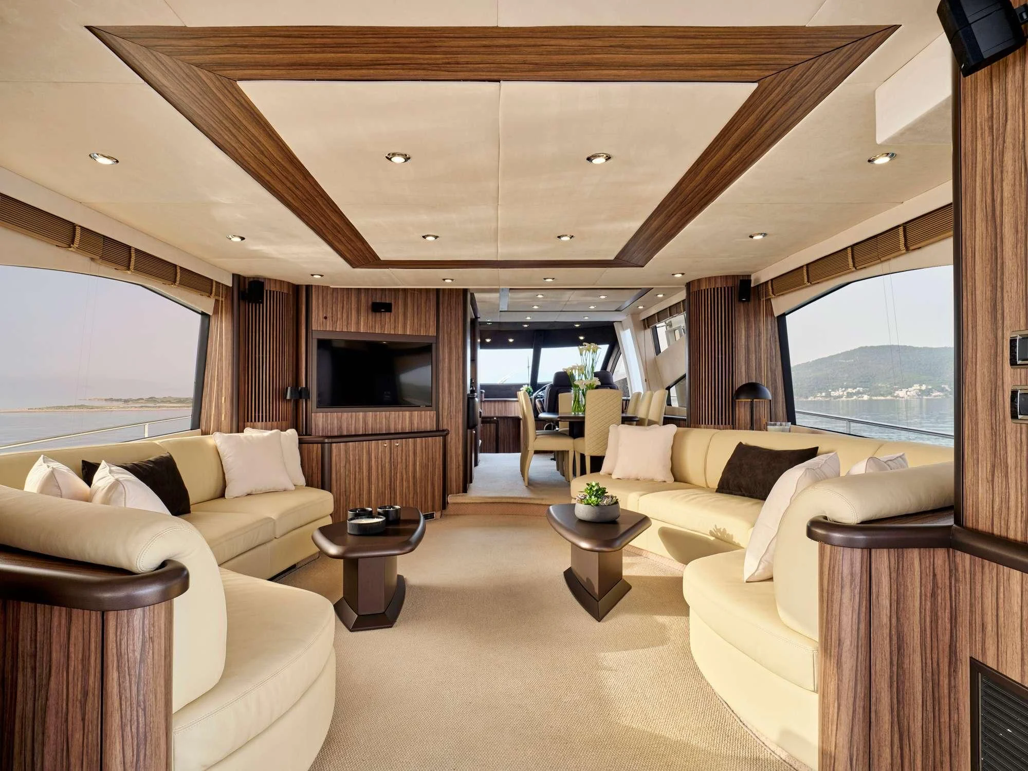 a living room with a large window aboard M FIVE Yacht for Charter