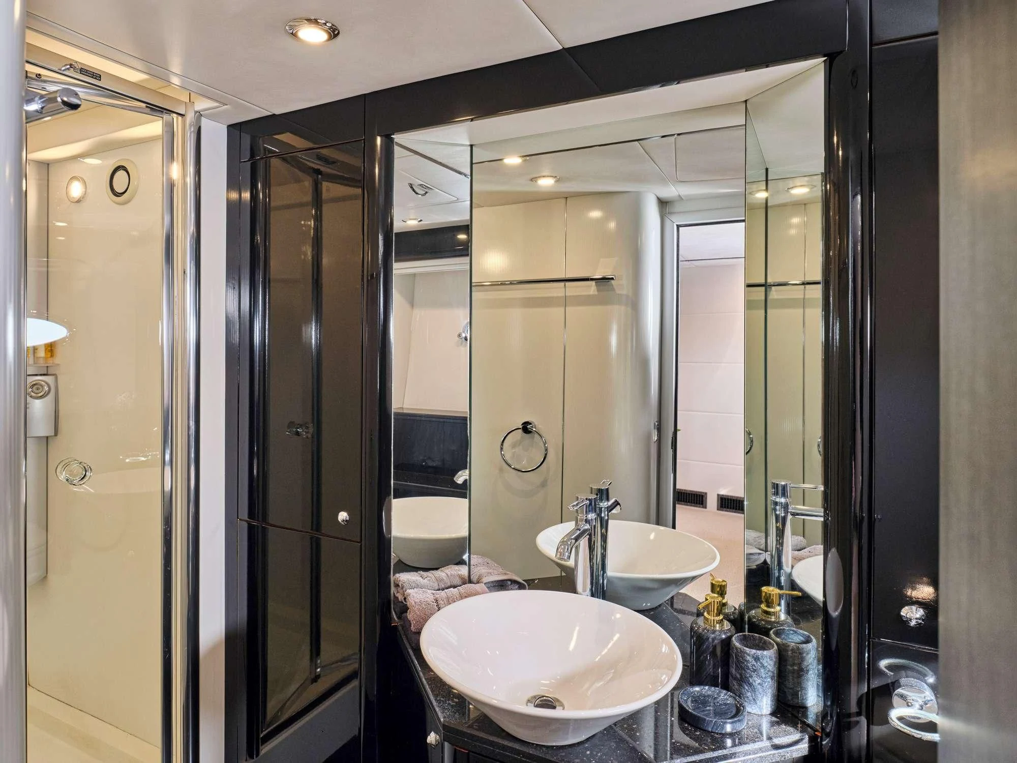 a bathroom with a large mirror aboard M FIVE Yacht for Charter
