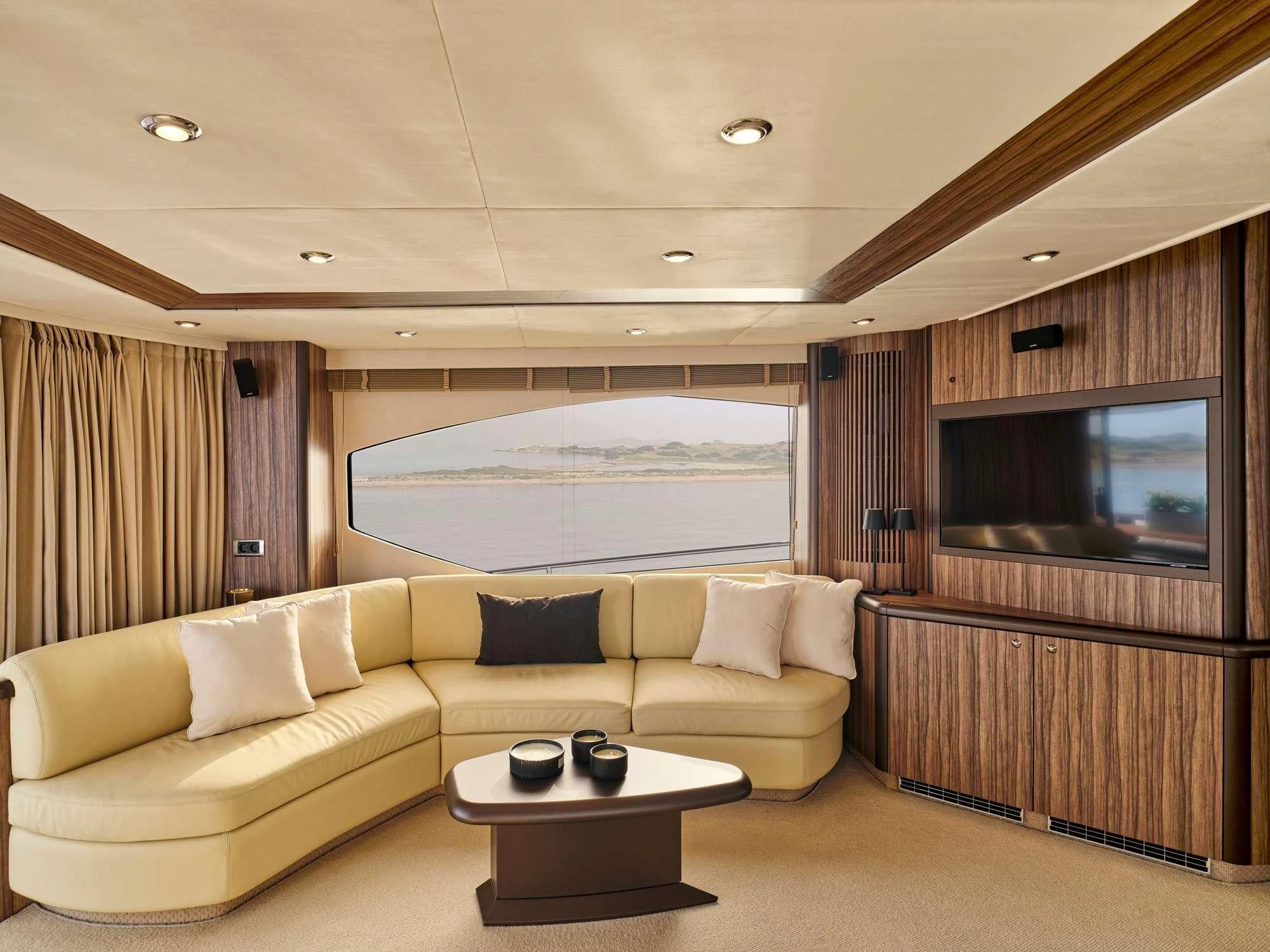 a living room with a large window aboard M FIVE Yacht for Charter