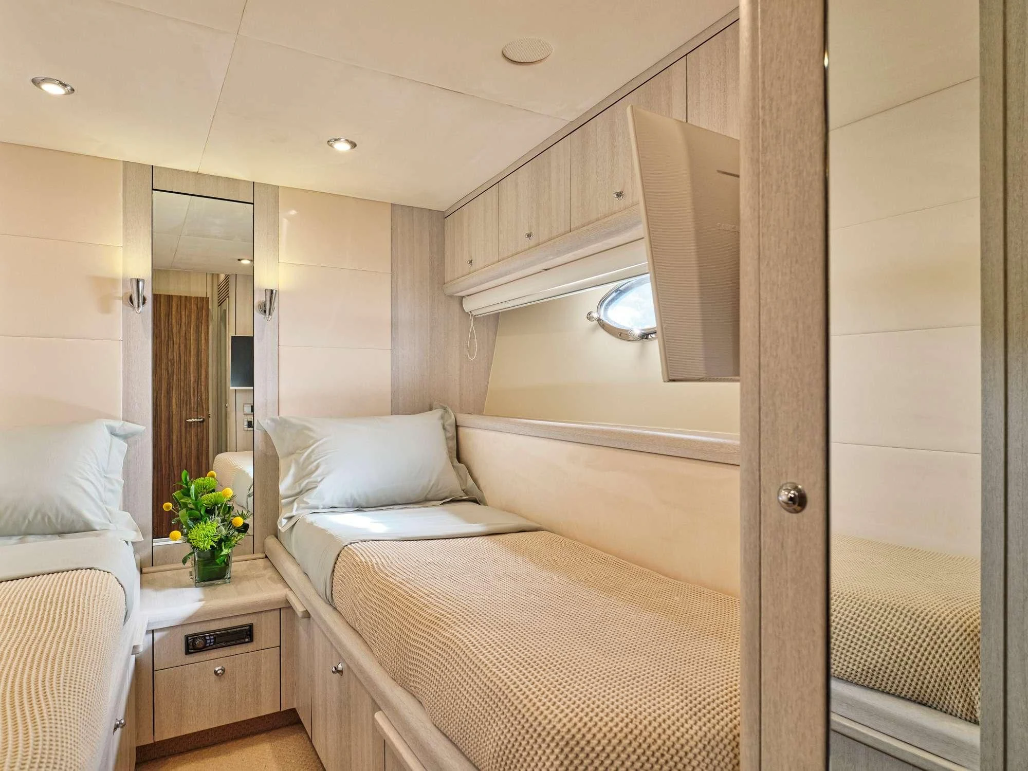 a room with a bed and a mirror aboard M FIVE Yacht for Charter