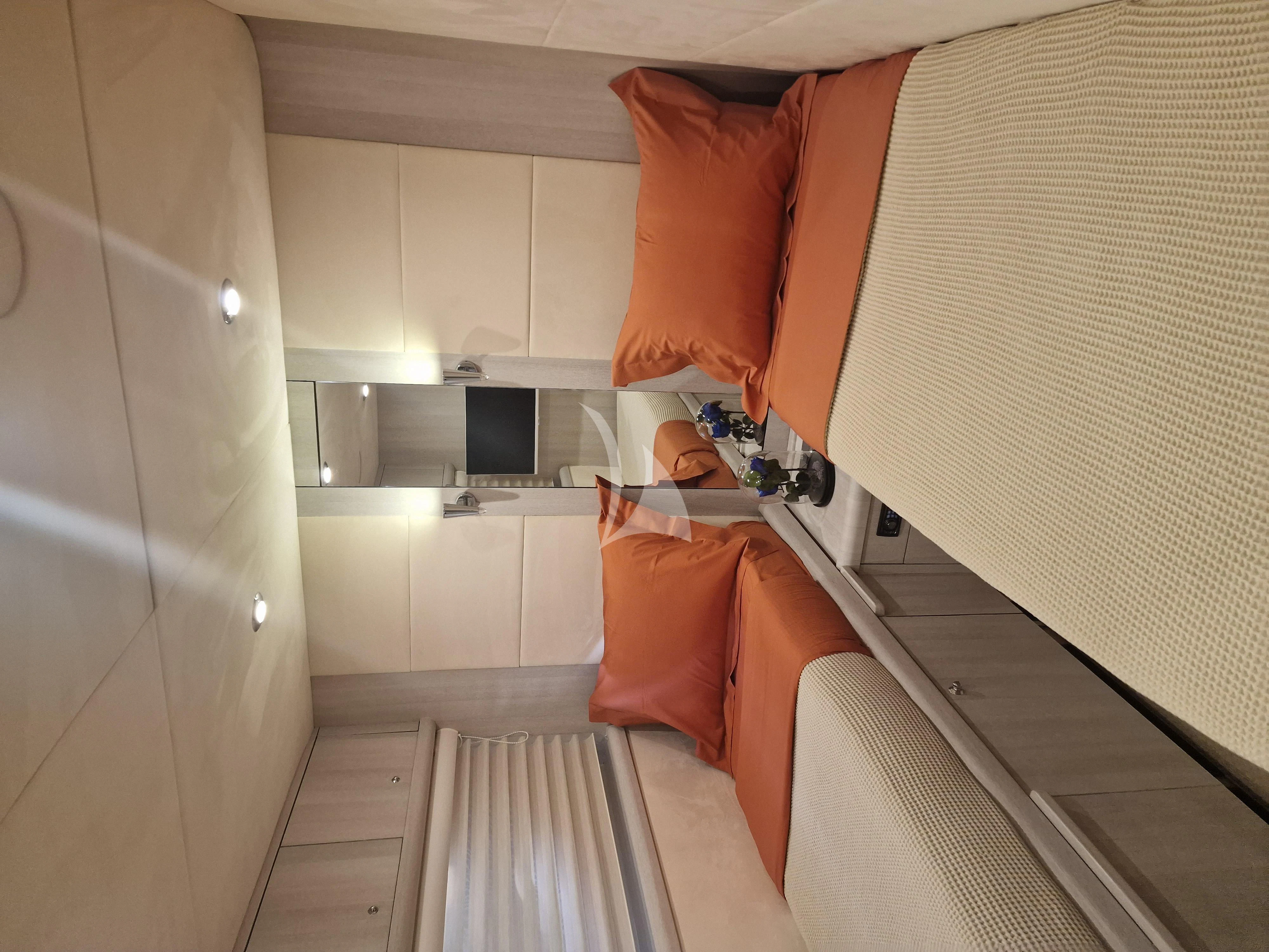 a person standing in a kitchen aboard M FIVE Yacht for Charter