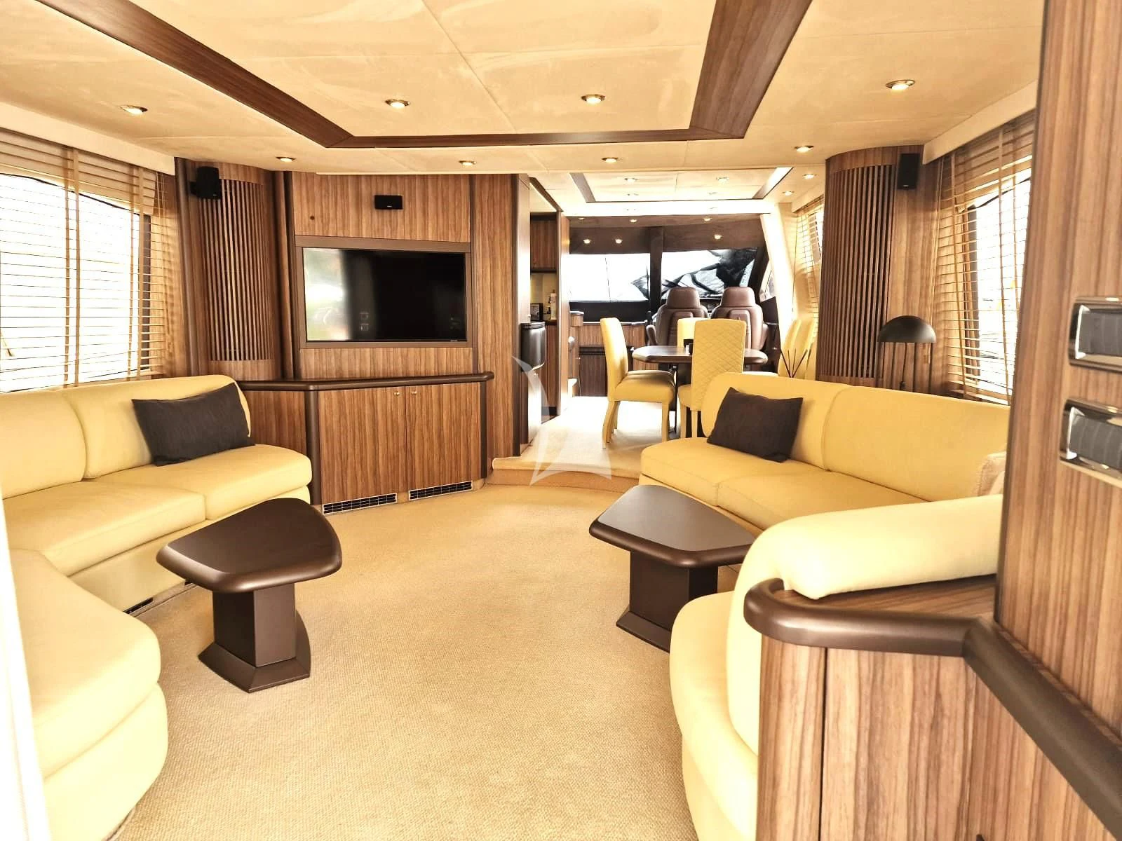 a living room with a couch and a tv aboard M FIVE Yacht for Charter