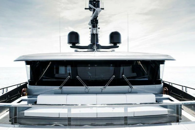 a white boat with a bell on the front aboard MY ALMA Yacht for Sale