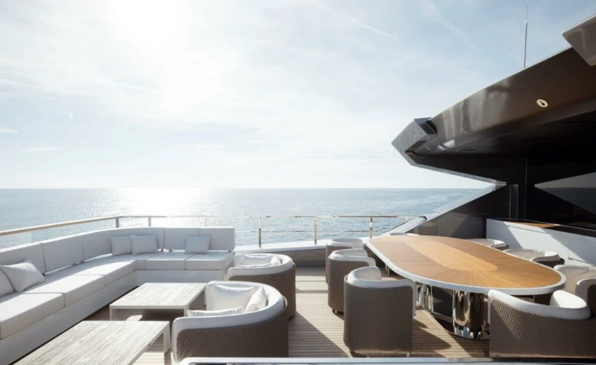 a room with a table chairs and a large body of water aboard MY ALMA Yacht for Sale