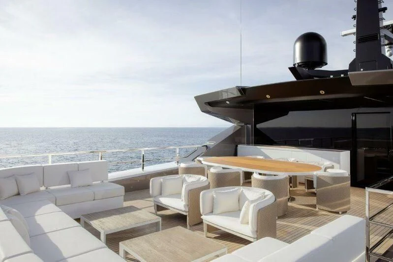a room with a table and chairs aboard MY ALMA Yacht for Sale