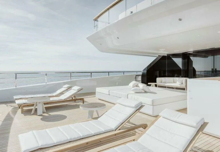 a room with white furniture aboard MY ALMA Yacht for Sale