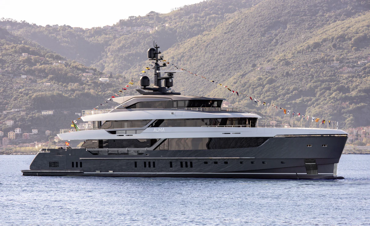 a large ship in the water aboard MY ALMA Yacht for Sale