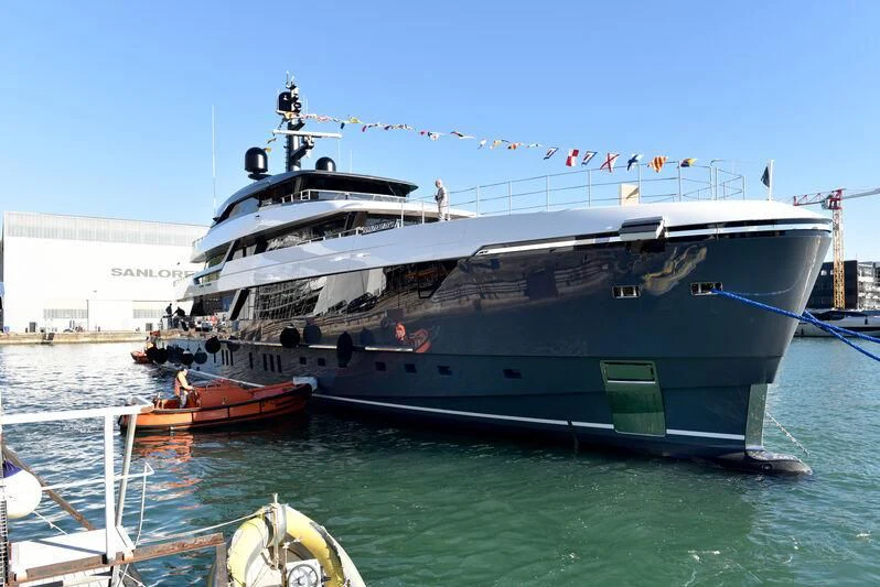 a large boat docked at a port aboard MY ALMA Yacht for Sale