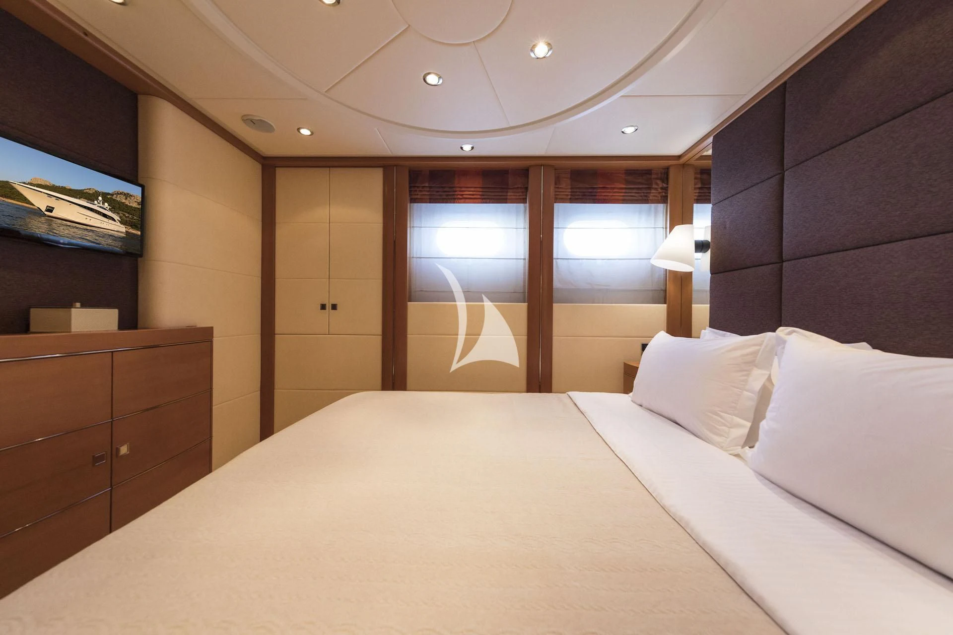 a bed in a room aboard L'EQUINOX Yacht for Sale