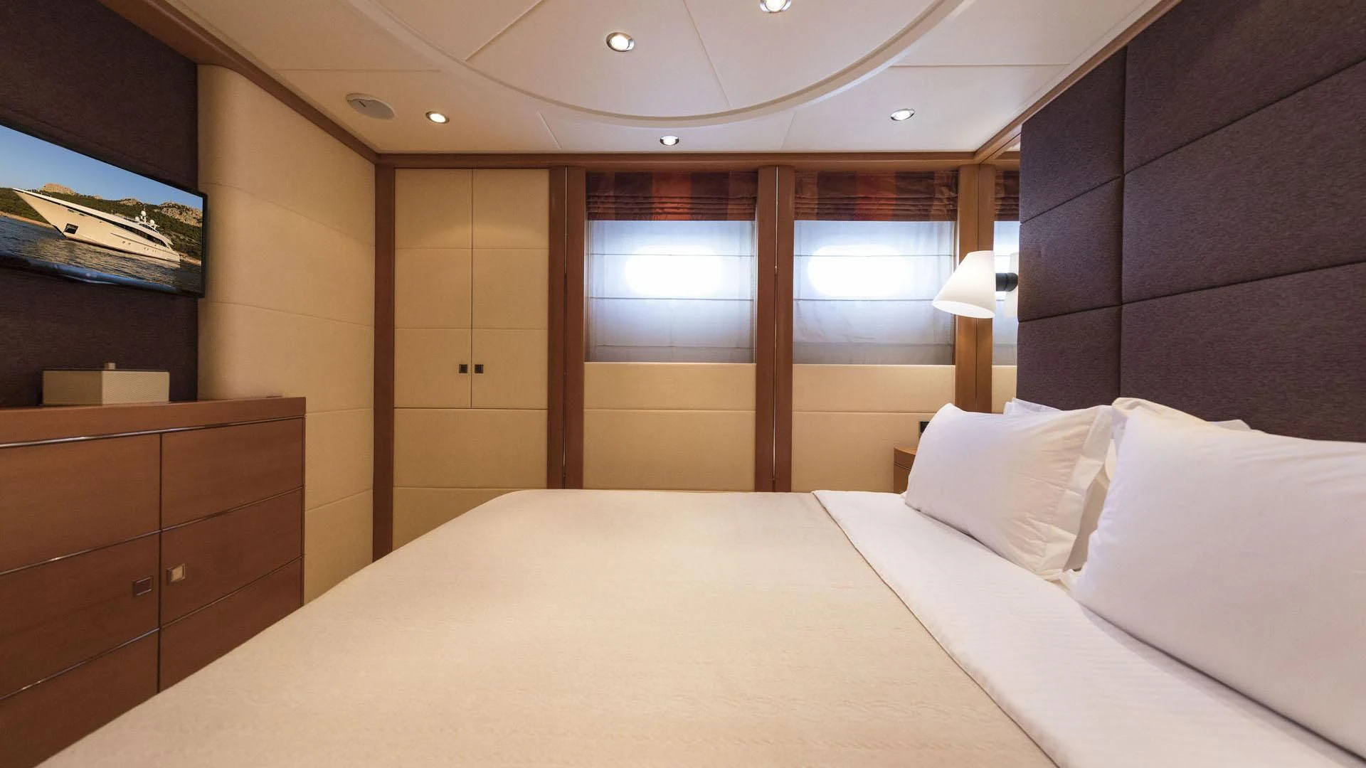 a bed with white sheets aboard L'EQUINOX Yacht for Sale