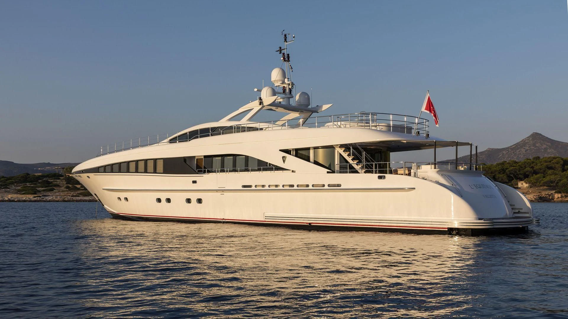 a large white boat on the water aboard L'EQUINOX Yacht for Sale