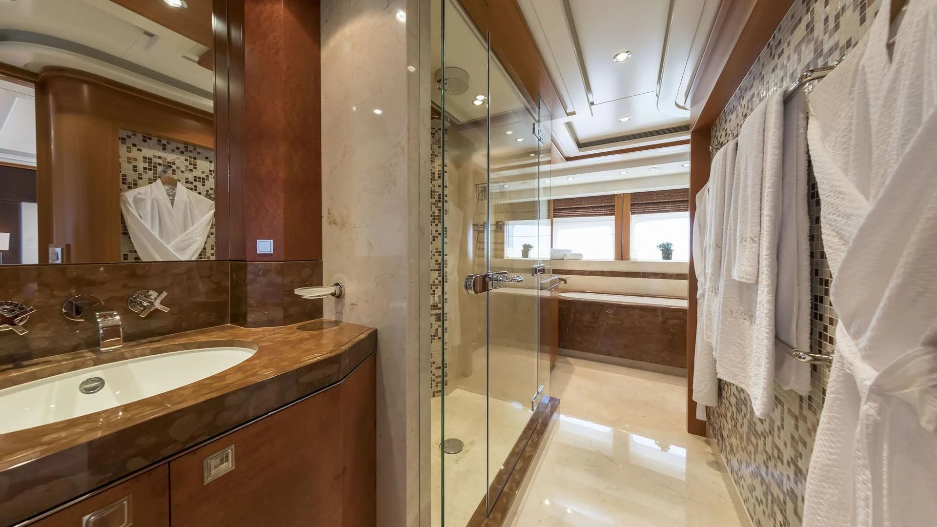 a bathroom with a large mirror aboard L'EQUINOX Yacht for Sale