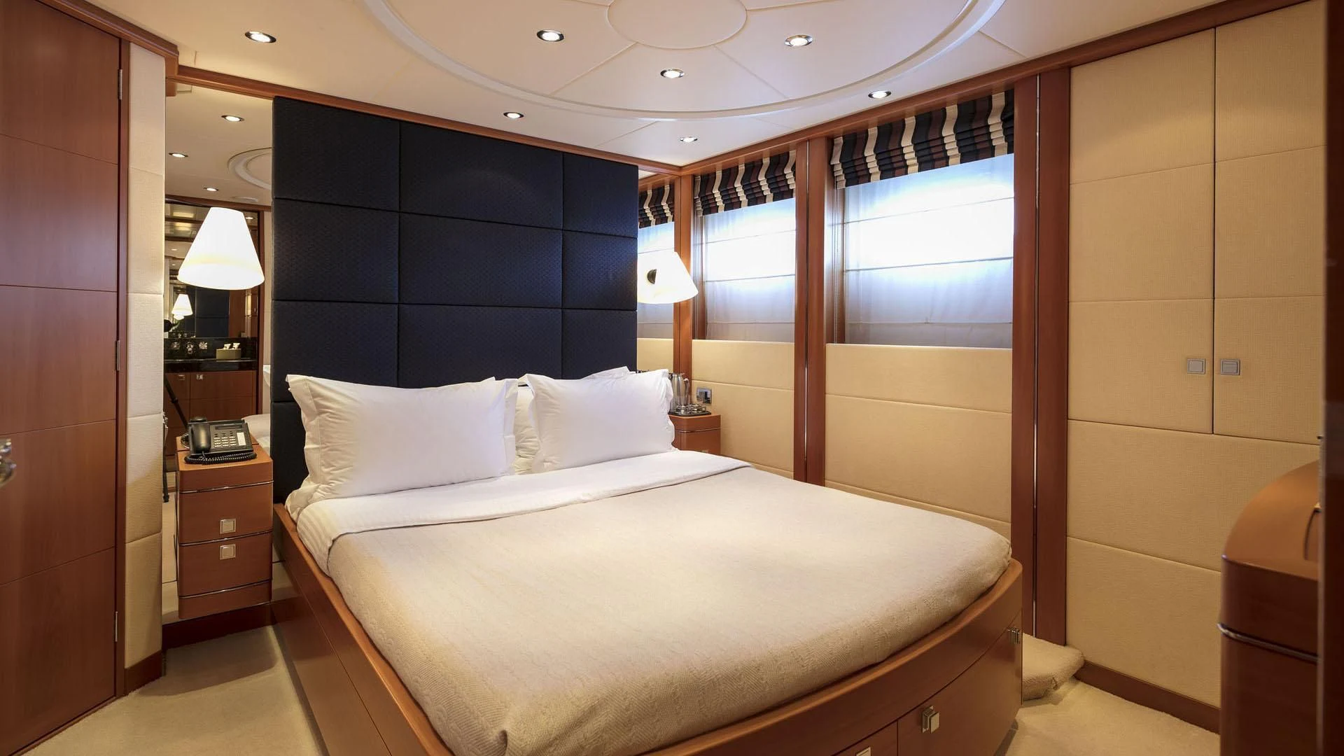 a bed in a room aboard L'EQUINOX Yacht for Sale