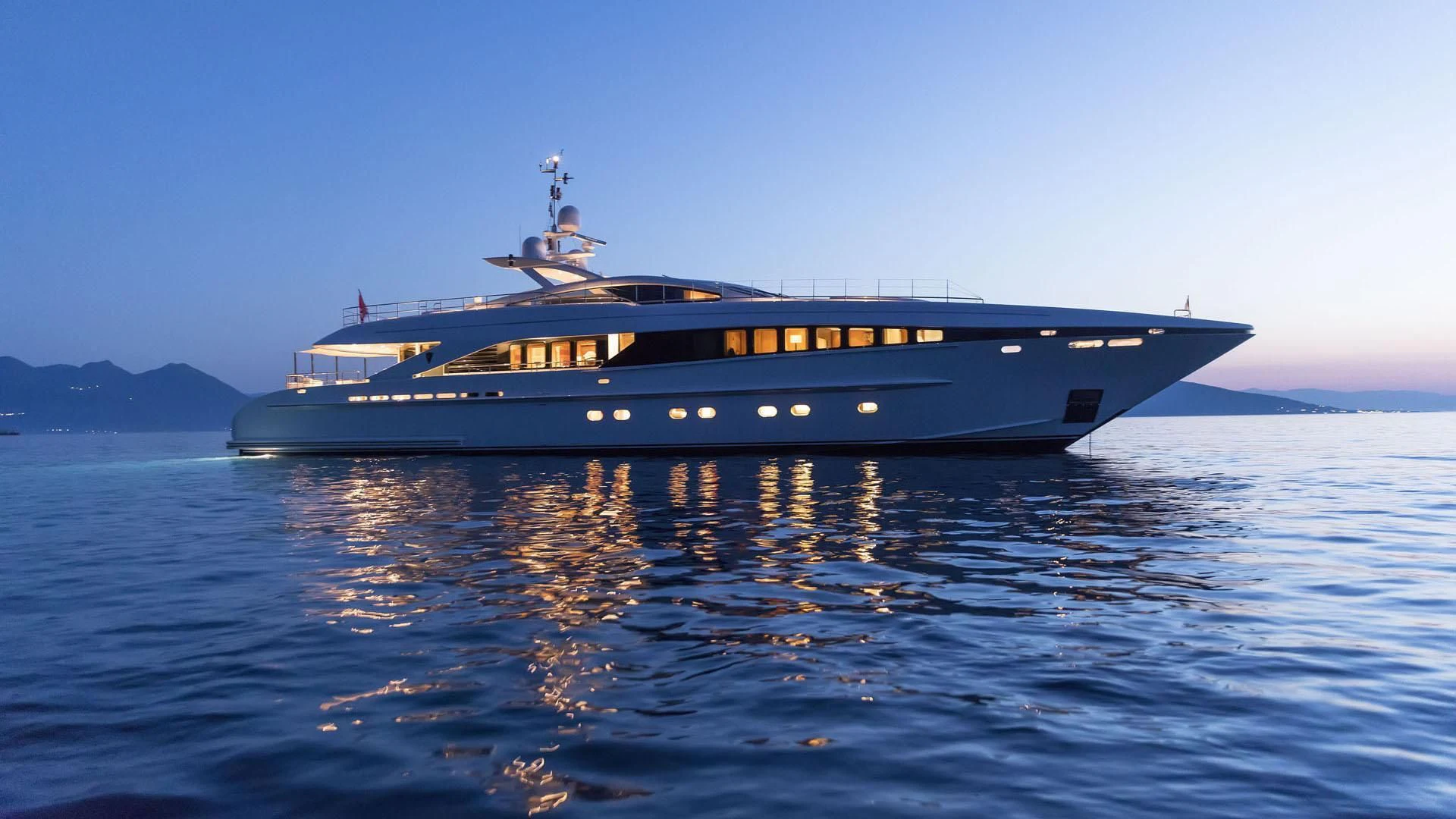 a large boat on the water aboard L'EQUINOX Yacht for Sale