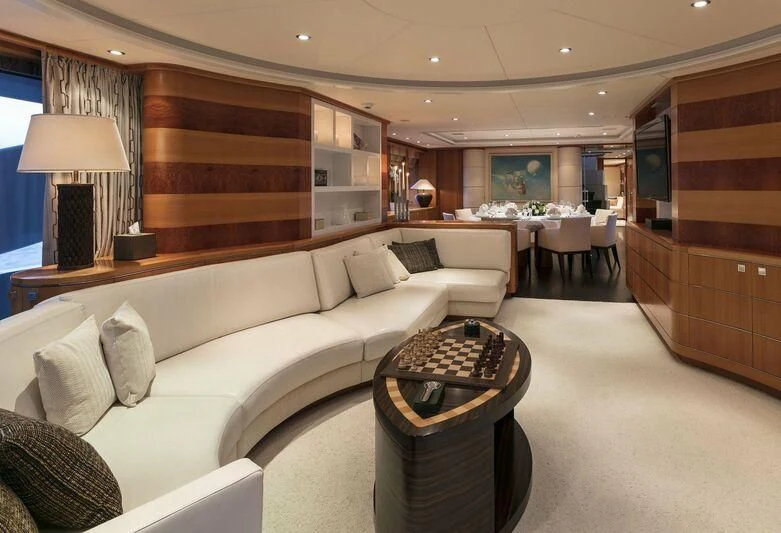 a living room with a couch and a coffee table aboard L'EQUINOX Yacht for Sale
