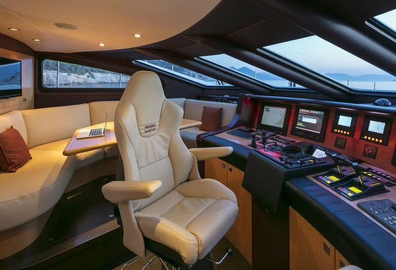 a room with many monitors and computers aboard L'EQUINOX Yacht for Sale