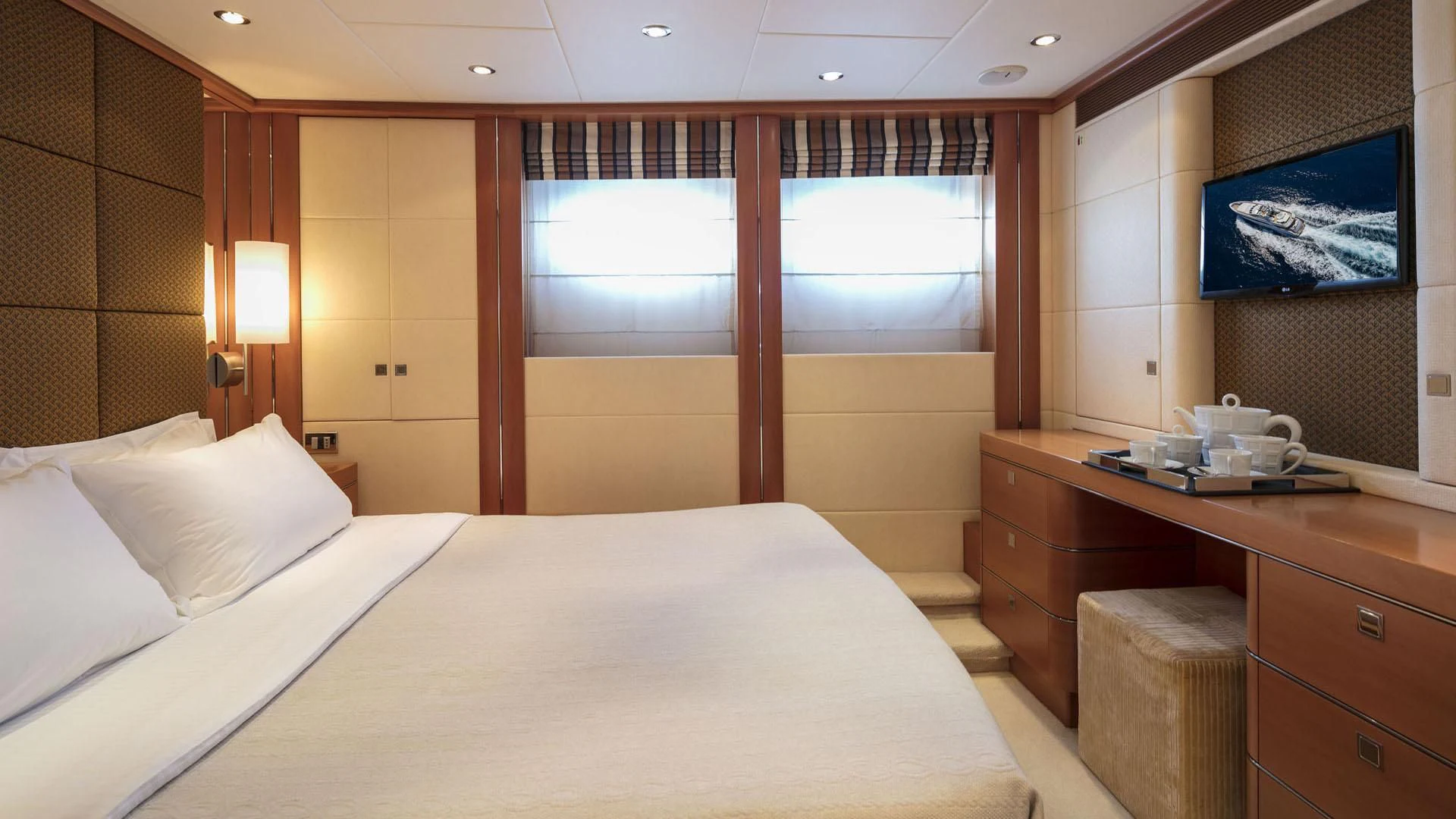 a room with a bed and a desk aboard L'EQUINOX Yacht for Sale