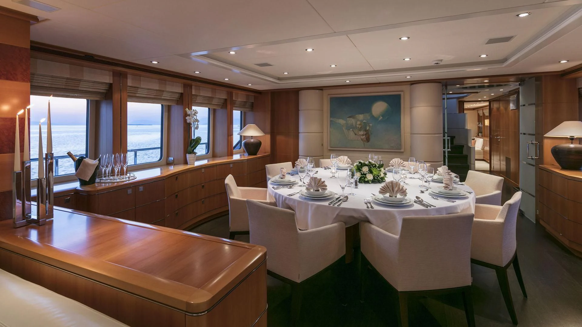 a large dining room with white tables aboard L'EQUINOX Yacht for Sale