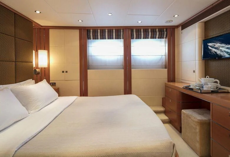 a bed in a room aboard L'EQUINOX Yacht for Sale