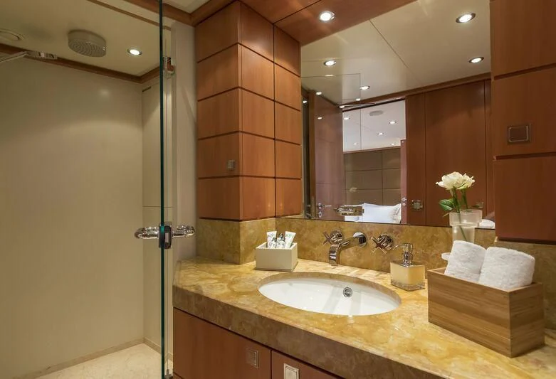a bathroom with a sink and a mirror aboard L'EQUINOX Yacht for Sale