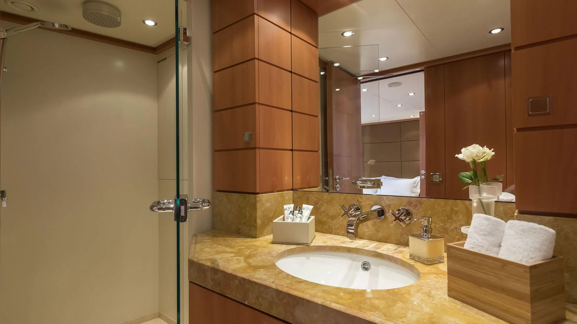 a bathroom with a sink and mirror aboard L'EQUINOX Yacht for Sale