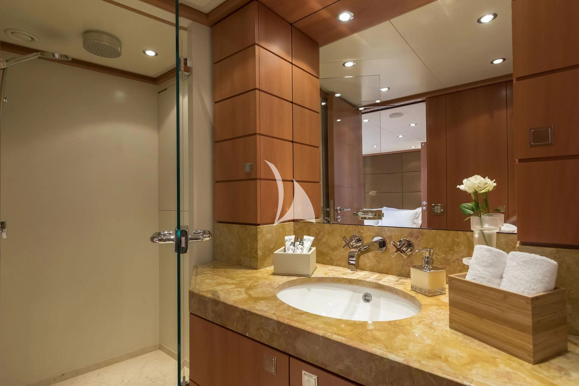 a bathroom with a sink and a mirror aboard L'EQUINOX Yacht for Sale