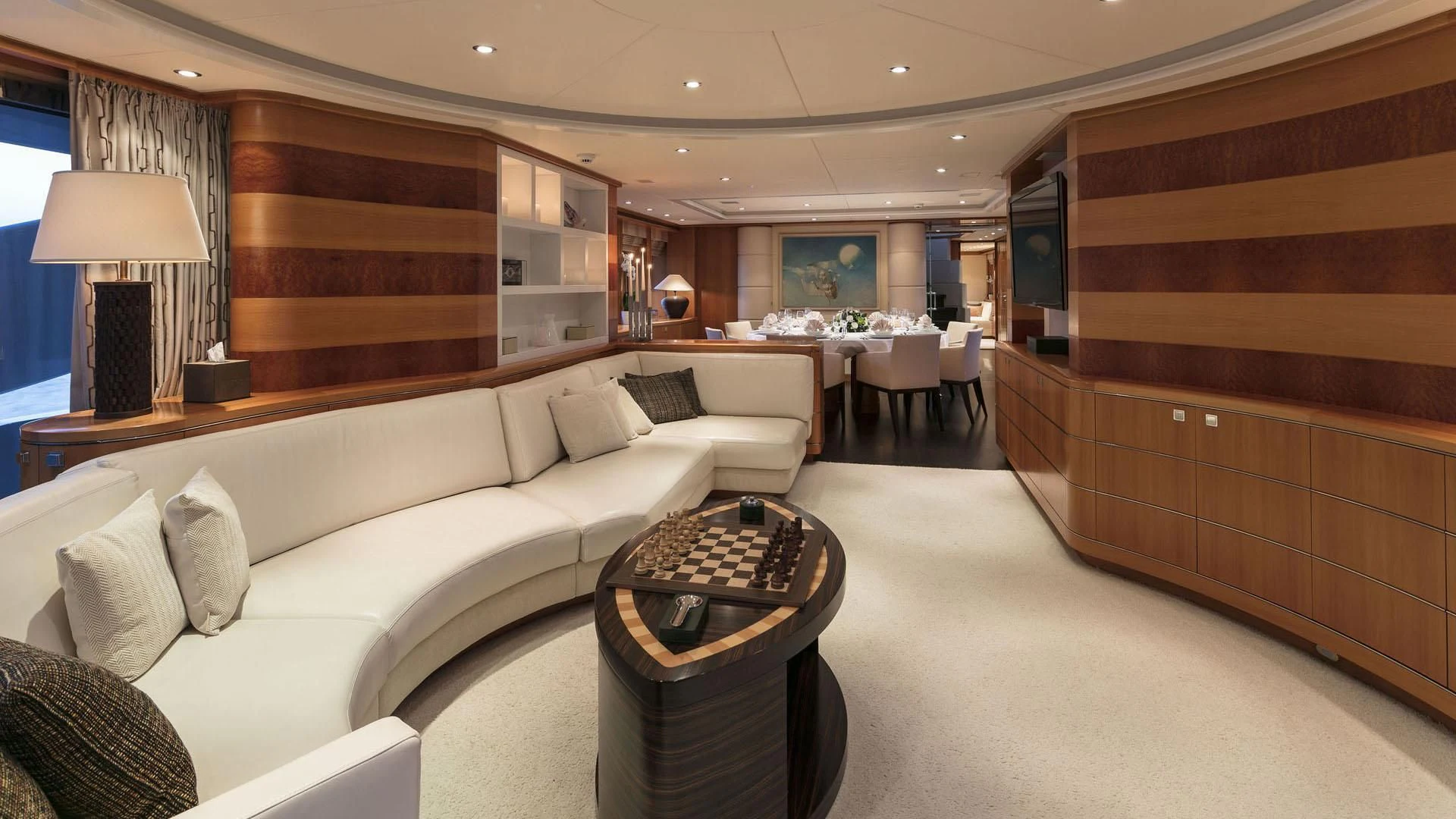 a living room with a couch and a coffee table aboard L'EQUINOX Yacht for Sale