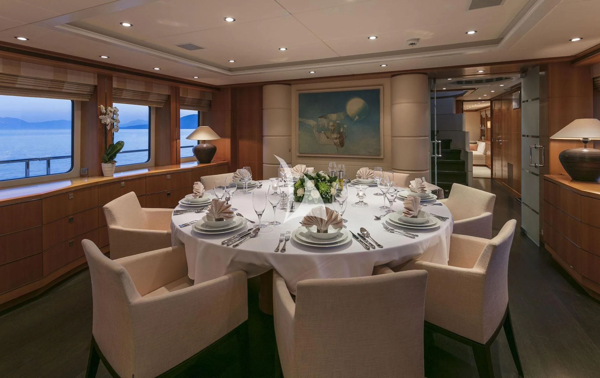 a dining room with white chairs aboard L'EQUINOX Yacht for Sale