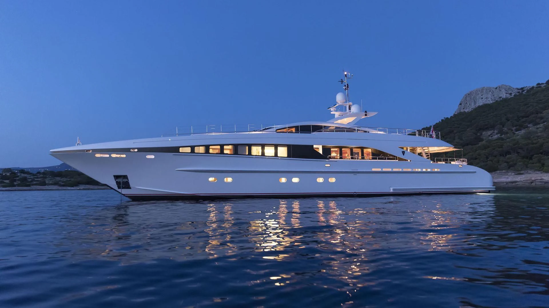 a white boat on water aboard L'EQUINOX Yacht for Sale