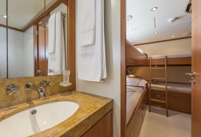 a bathroom with a sink and a mirror aboard L'EQUINOX Yacht for Sale