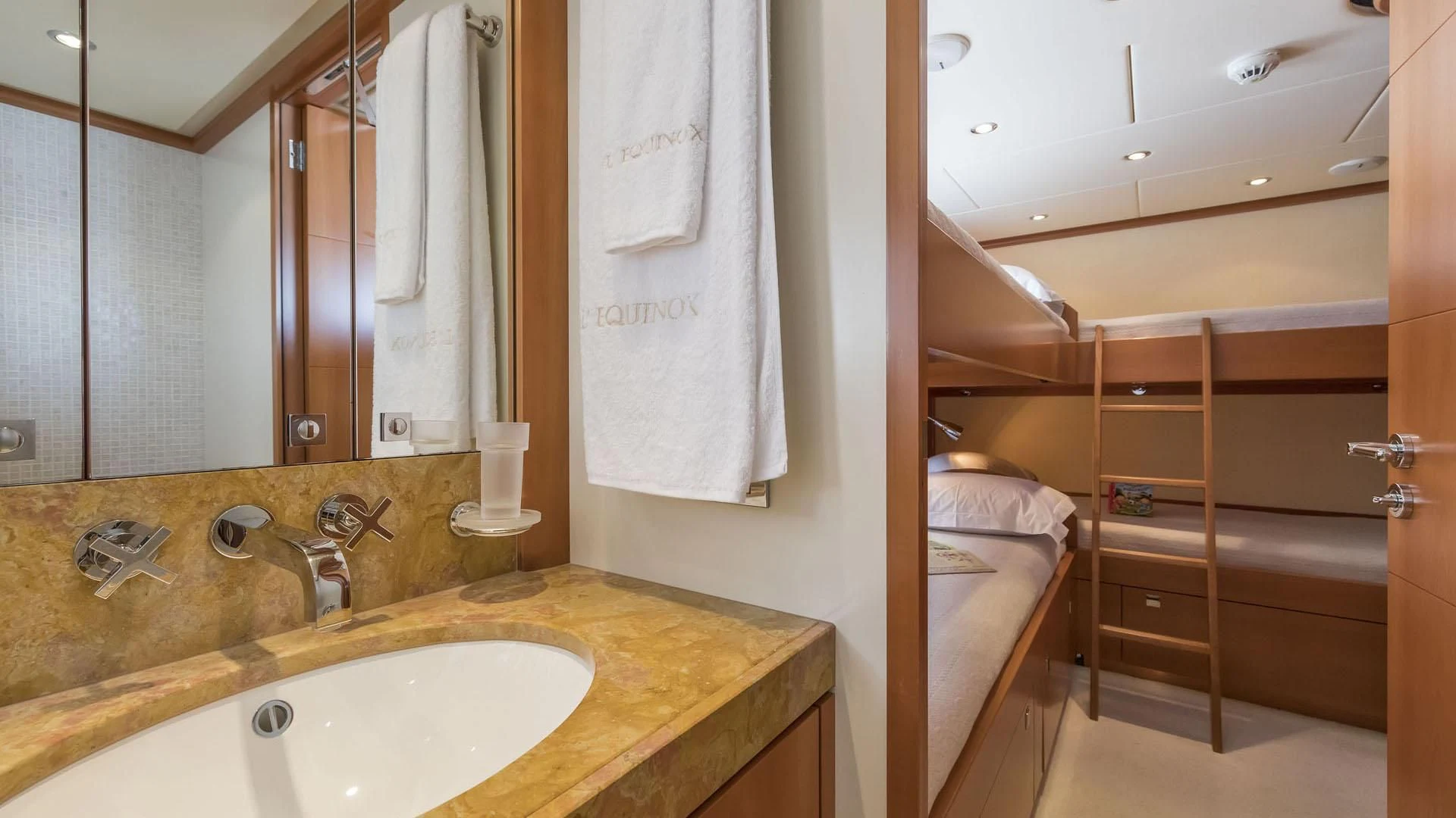 a bathroom with a sink and a mirror aboard L'EQUINOX Yacht for Sale