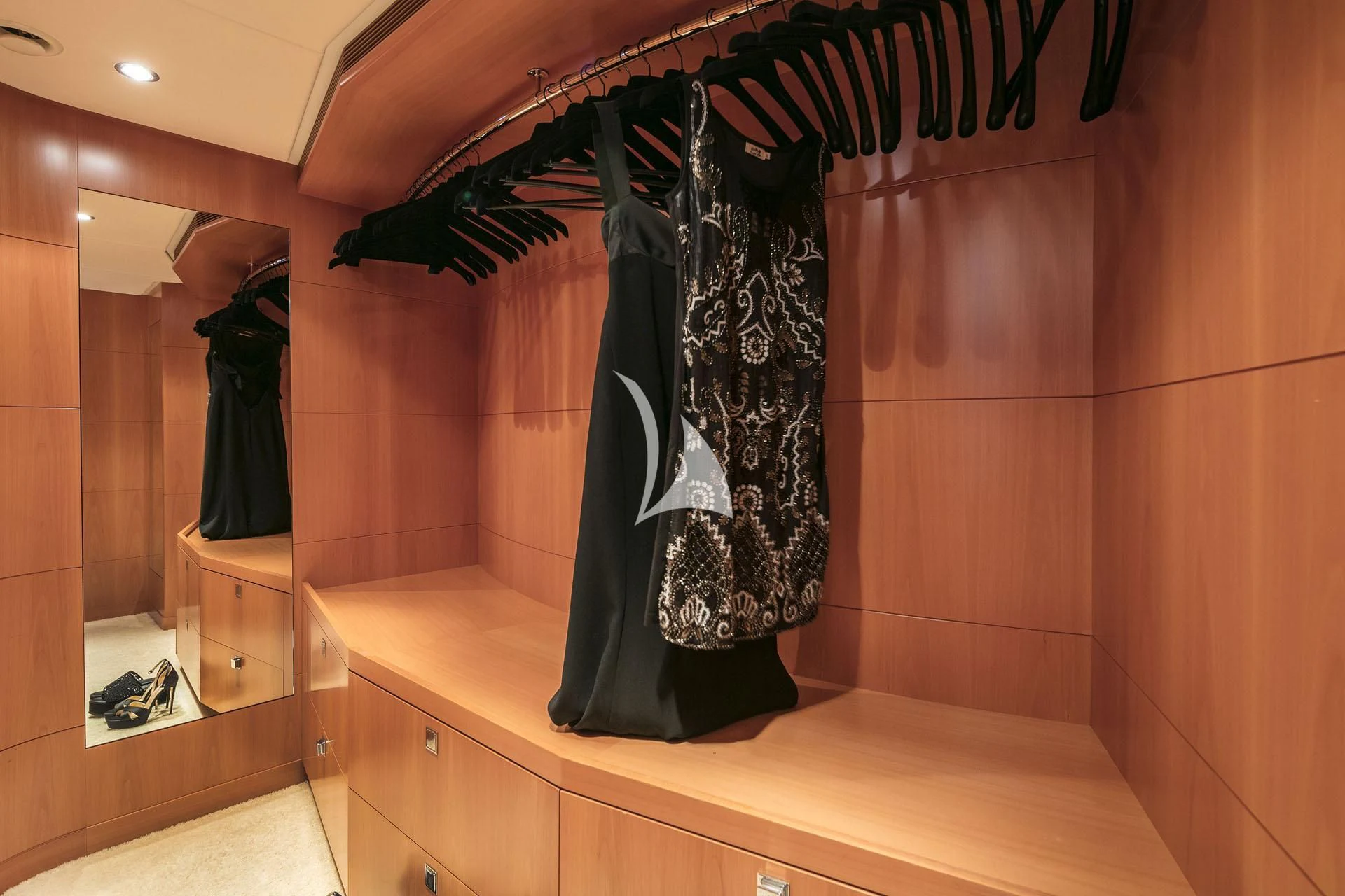 a black and white dress on a rack in a bathroom aboard L'EQUINOX Yacht for Sale