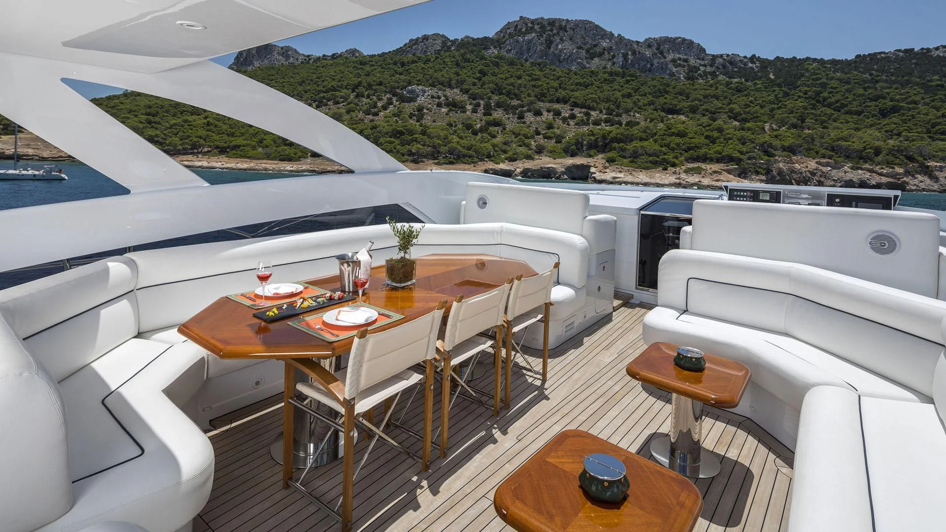 a room with a table and chairs aboard L'EQUINOX Yacht for Sale