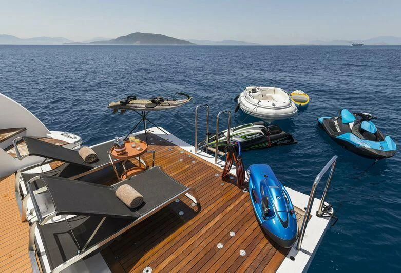 a boat with a dock and boats on it aboard L'EQUINOX Yacht for Sale