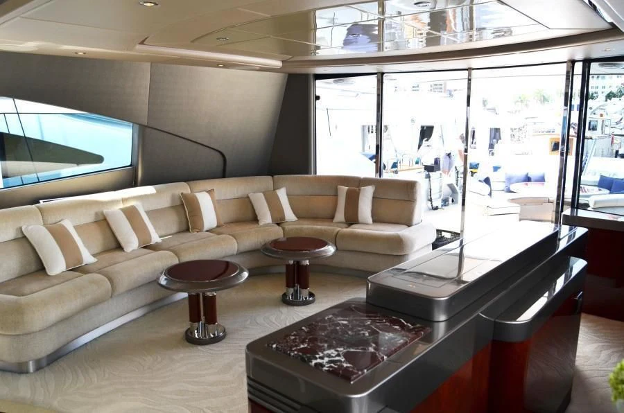a room with a couch and a table aboard INVICTA Yacht for Sale