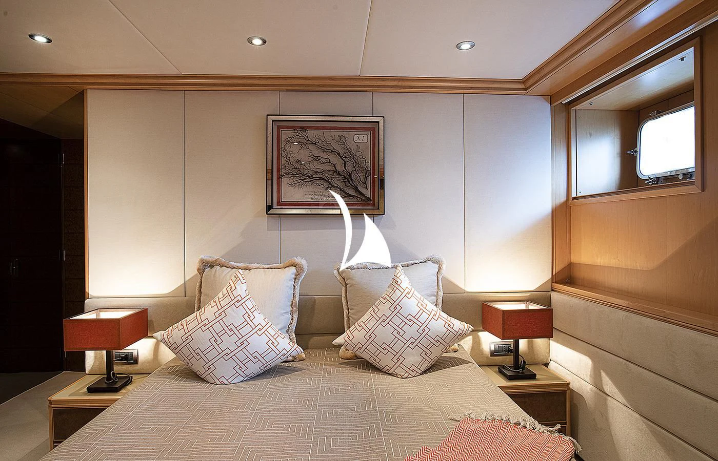 a bed with pillows aboard DEEP BLUE II Yacht for Charter