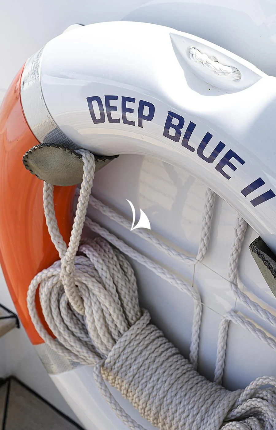 a white helmet with a blue label aboard DEEP BLUE II Yacht for Charter