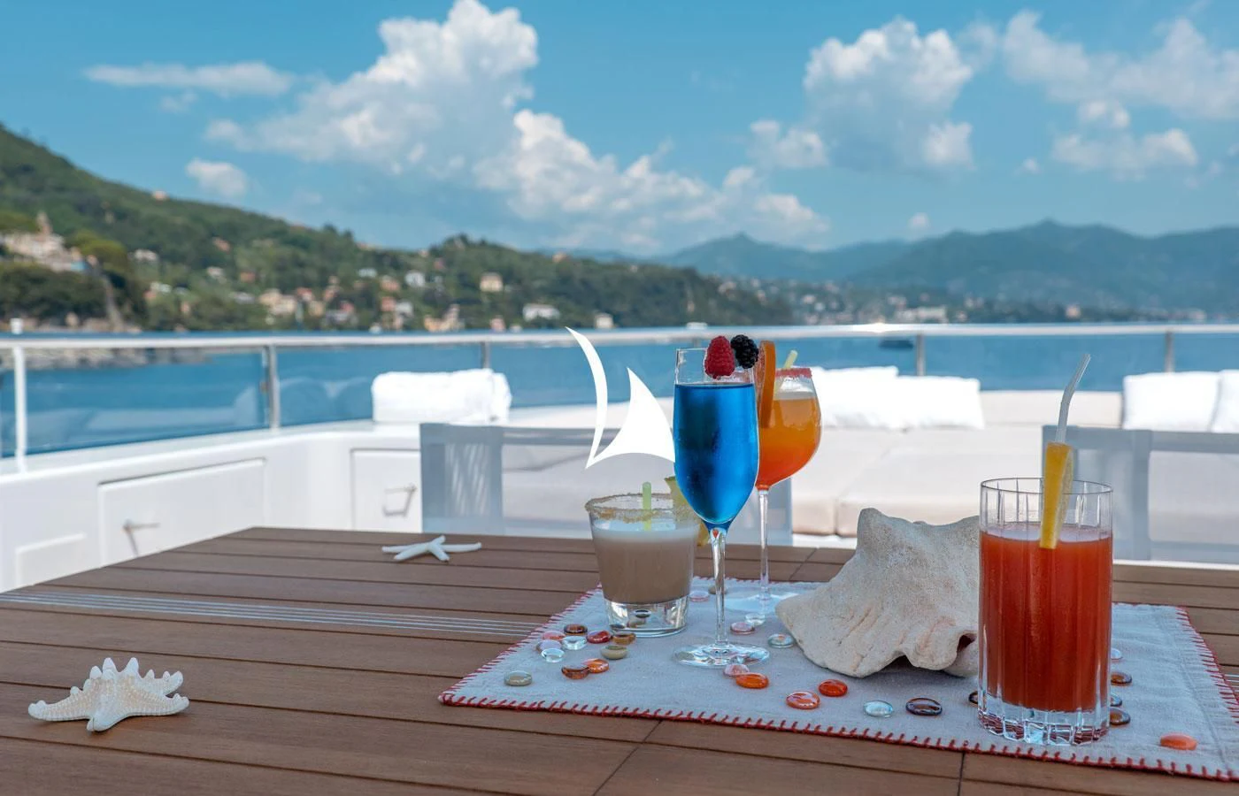 a table with drinks on it aboard DEEP BLUE II Yacht for Charter