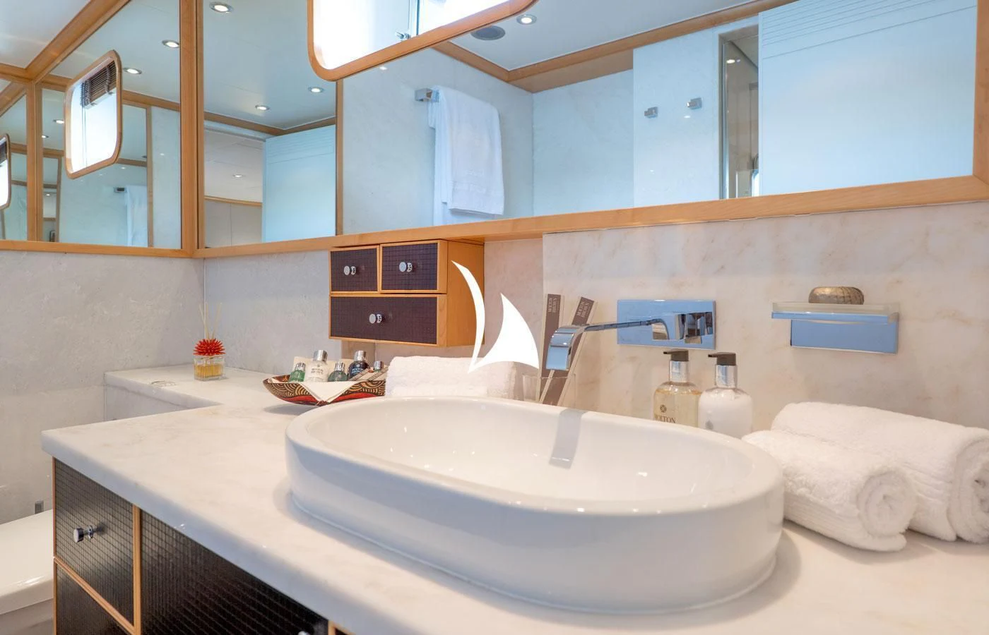 a bathroom with a large mirror aboard DEEP BLUE II Yacht for Charter