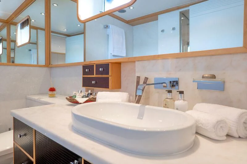 a bathroom with a large mirror aboard DEEP BLUE II Yacht for Charter