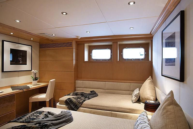 a room with a couch and a table and a tv aboard DEEP BLUE II Yacht for Charter