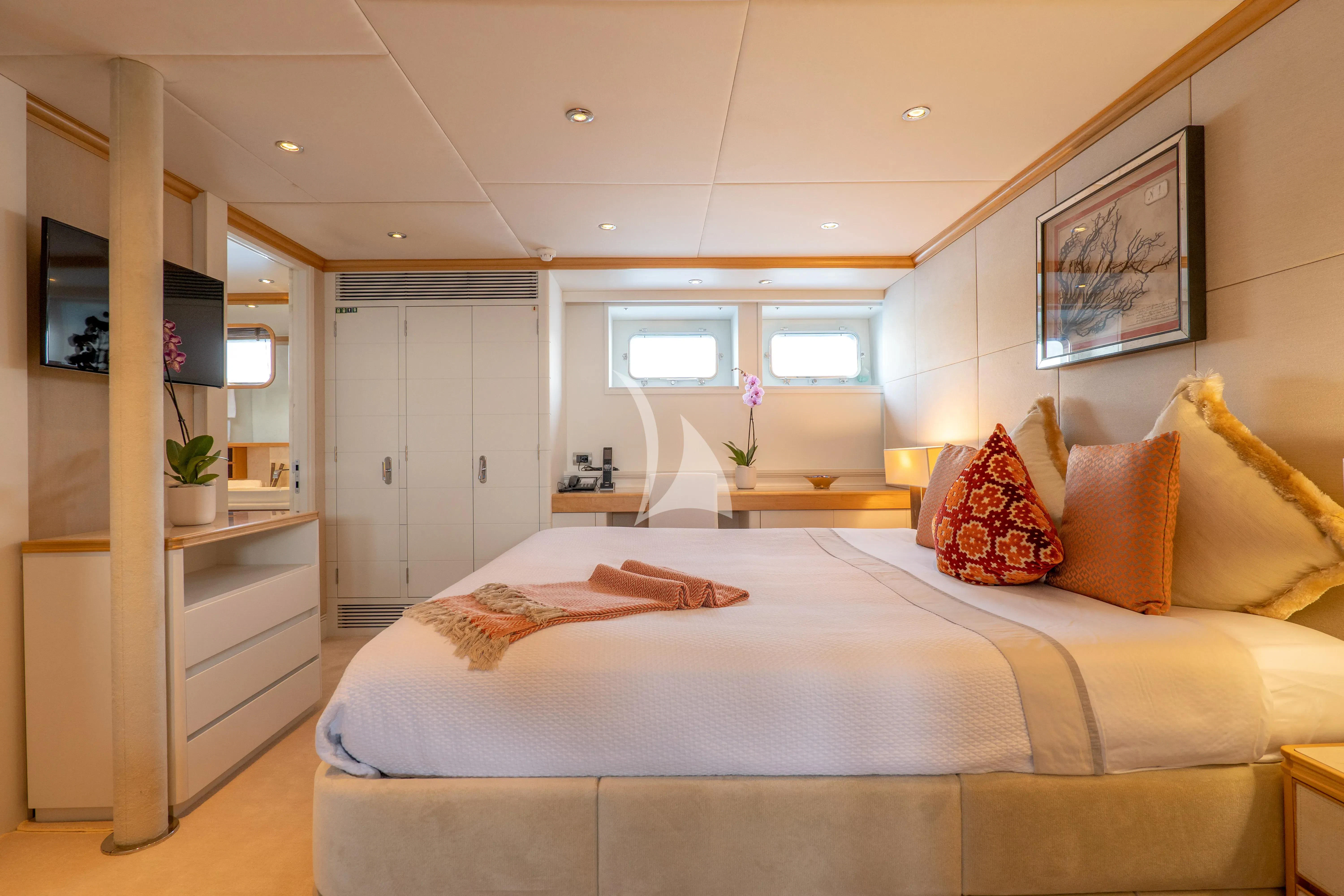 a large bed in a room aboard DEEP BLUE II Yacht for Charter
