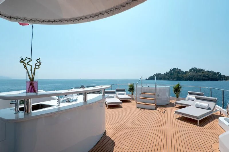 a room with a table and chairs aboard DEEP BLUE II Yacht for Charter