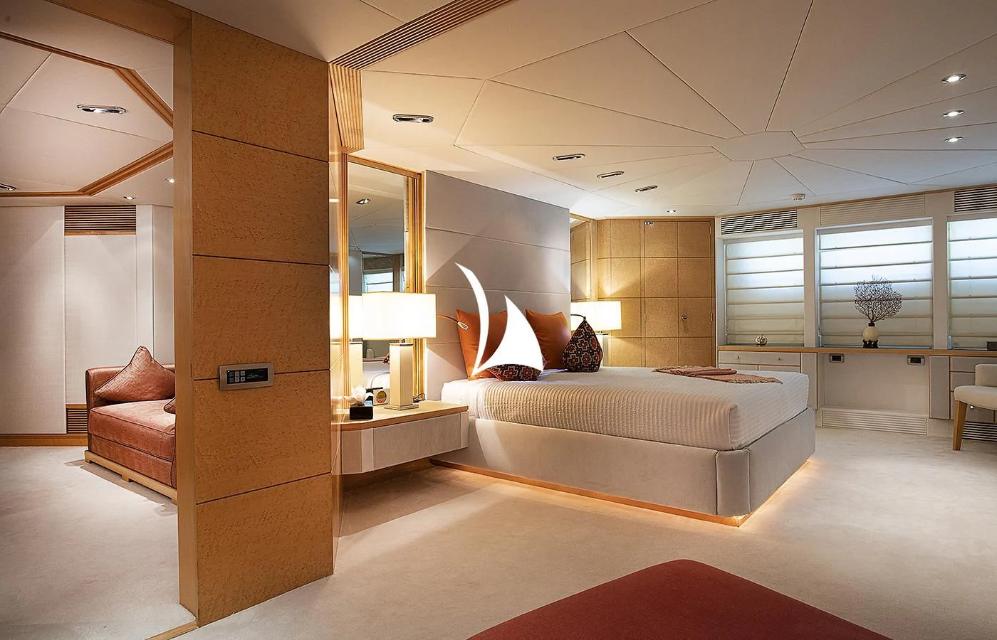 a large modern bedroom with a large bed and a large mirror aboard DEEP BLUE II Yacht for Charter