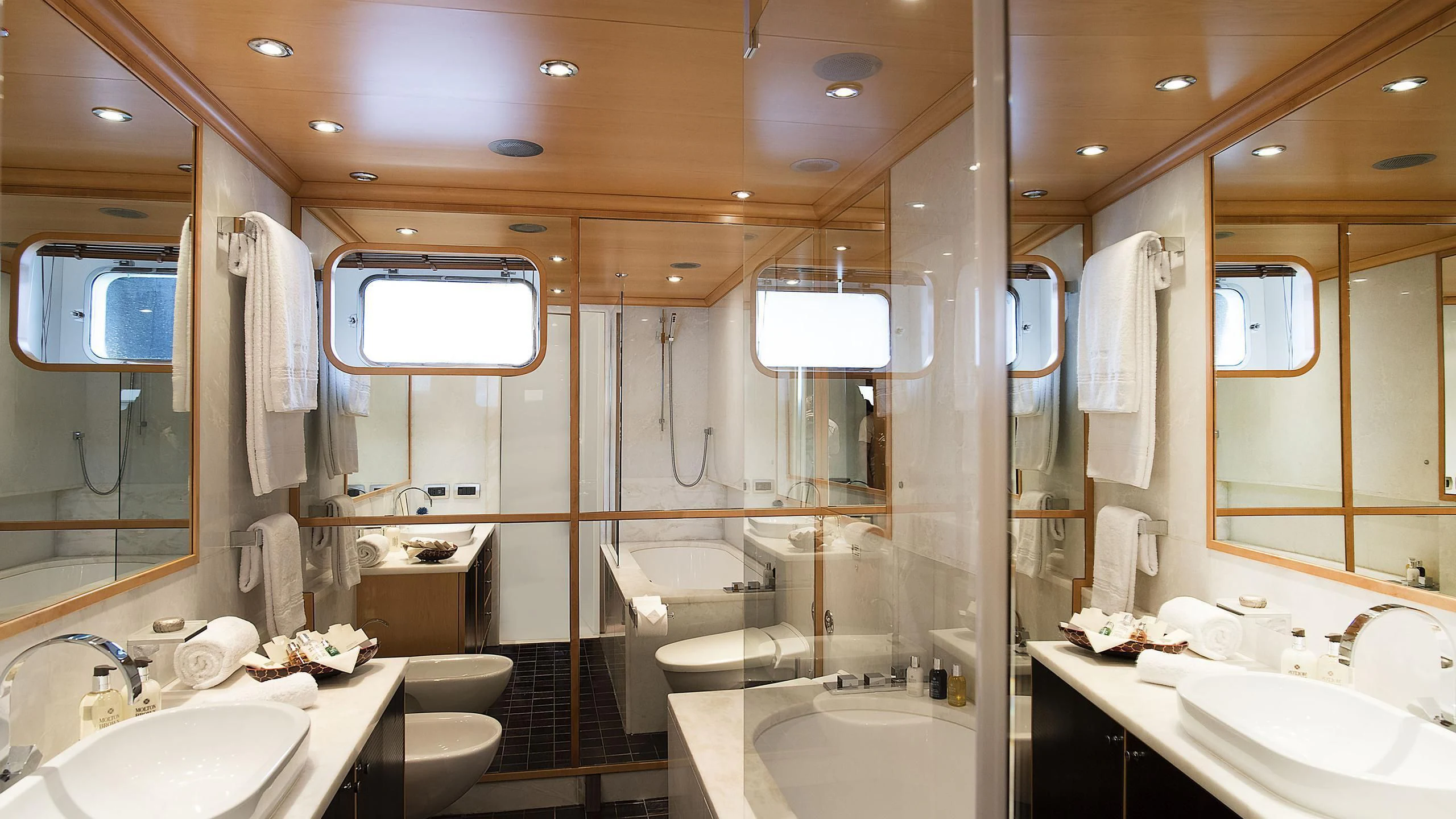 a bathroom with a large shower aboard DEEP BLUE II Yacht for Charter